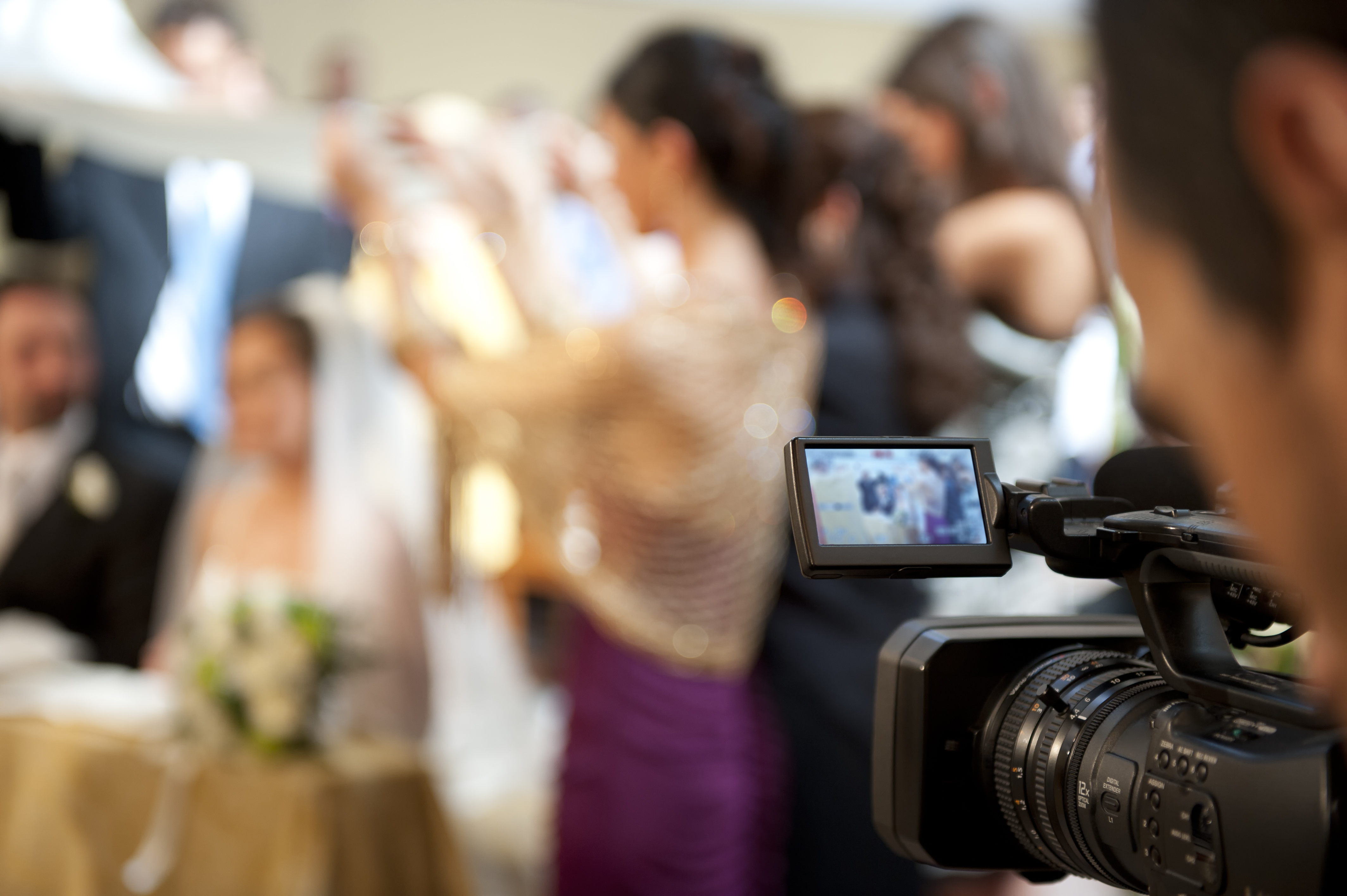 Cameraman recording video of a marriage